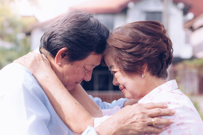 Portrait of couple kissing outdoors