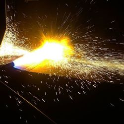 Illuminated ferris wheel at night