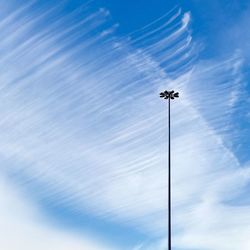 Low angle view of floodlight against sky