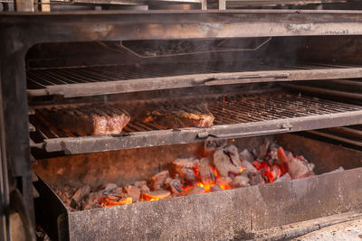 Close-up of firewood on barbecue grill