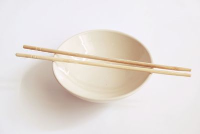 Close-up of bowl over white background