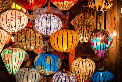 Illuminated lanterns hanging in corridor