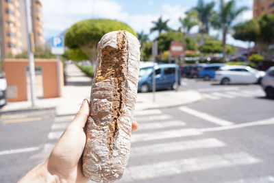 Close-up of hand holding ice cream cone