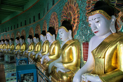 Statues in temple outside building