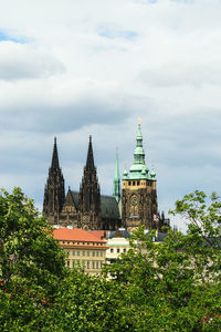 View of temple building against cloudy sky