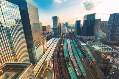 High angle view of railroad tracks amidst buildings in city