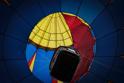 Low angle view of hot air balloon against blue sky