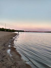 Scenic view of beach against clear sky