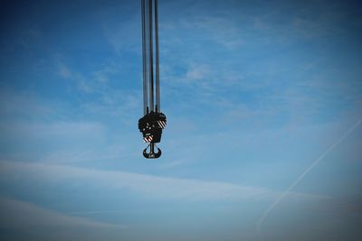 Low angle view of street light against sky