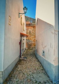 Walkway amidst buildings