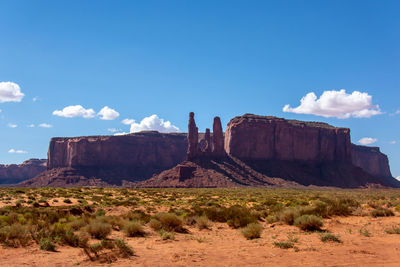 Rock formations on landscape against sky