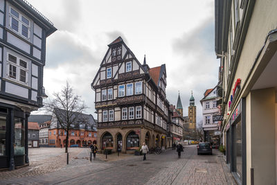 Street amidst buildings against sky