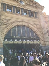 Group of people in front of historical building