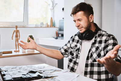 Man enjoy to many dollar banknotes