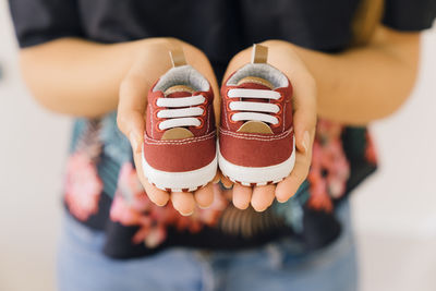 Low section of woman wearing shoes