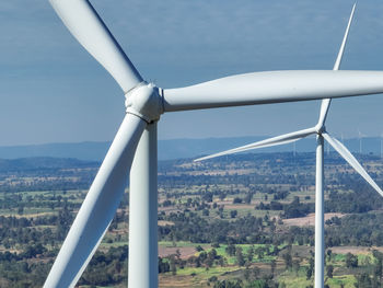 Low angle view of windmill against sky