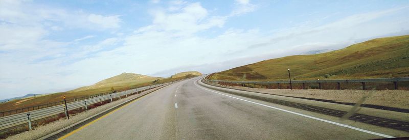 Road on mountain against sky