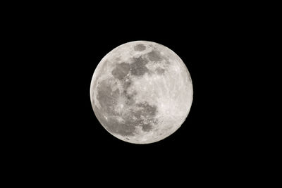 Low angle view of full moon at night