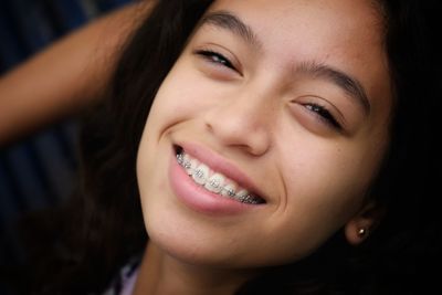 Close-up portrait of smiling teenage girls