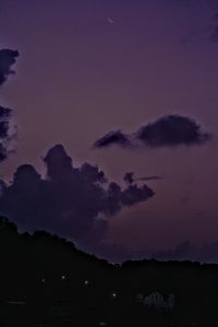 Low angle view of silhouette trees against sky at sunset