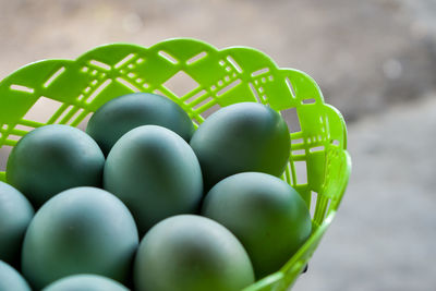 Close-up of green balls in basket