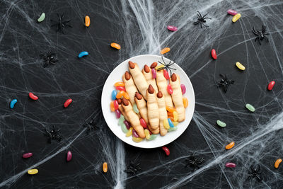 High angle view of multi colored candies on table