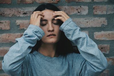 Close-up of young woman with eyes closed