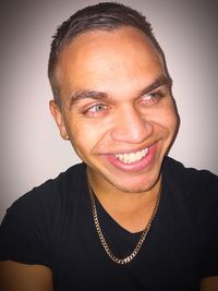 Close-up portrait of a smiling young man