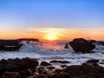 Scenic view of sea against sky during sunset