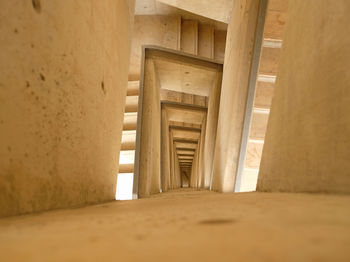 Top down view of stairs. emergency exit concept. winding stairs are empty. abstract beige background