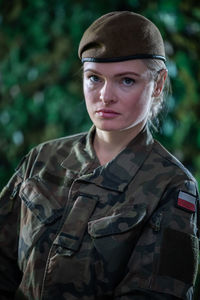 Portrait of a young lady soldier in military clothing while on duty.