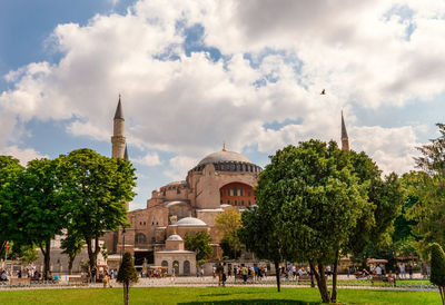 Panoramic view of trees and buildings against sky