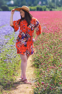 Full length of woman standing on field