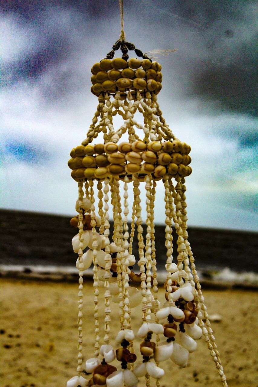 CLOSE-UP OF CHAIN AGAINST SEA