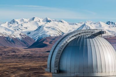 Snow covered mountains against sky