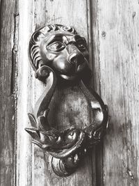 Close-up of sculpture on door