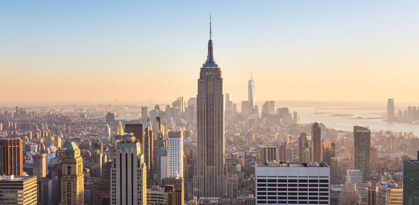 Modern buildings in city against clear sky