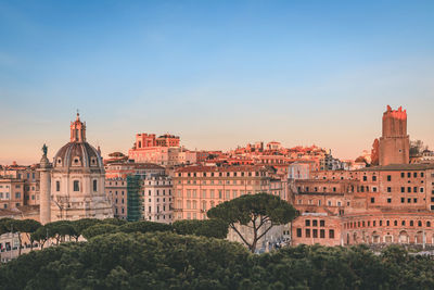 Buildings in city against sky