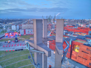 High angle view of buildings in city against sky