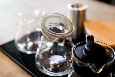 Close-up of jugs on table