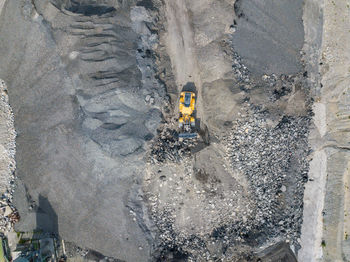 High angle view of yellow rock on land