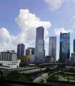 City skyline against cloudy sky