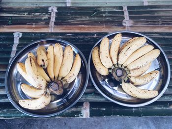 High angle view of bananas in plates on table