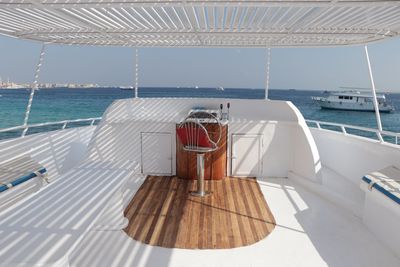 Rear view of woman in sea against sky