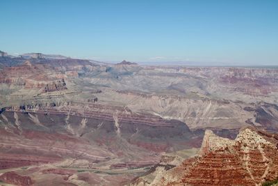 Aerial view of landscape with mountain range in background