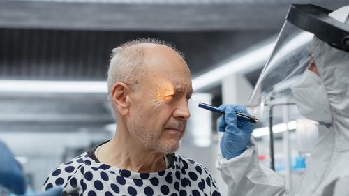 Close-up of young man drinking water