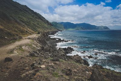 Scenic view of sea against cloudy sky