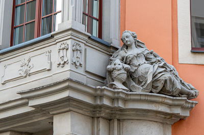 Low angle view of statue against building