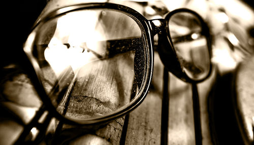 Close-up of eyeglasses on metal grate