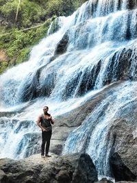 Full length of man standing on rock